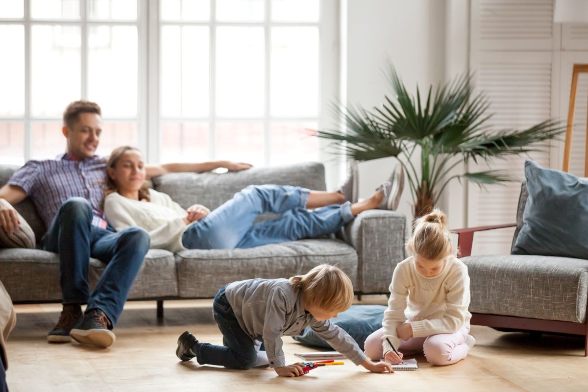 Children sister and brother playing drawing together on floor while